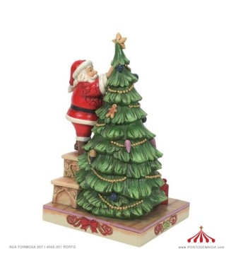 © Pai Natal a decorar a árvore - Jim Shore